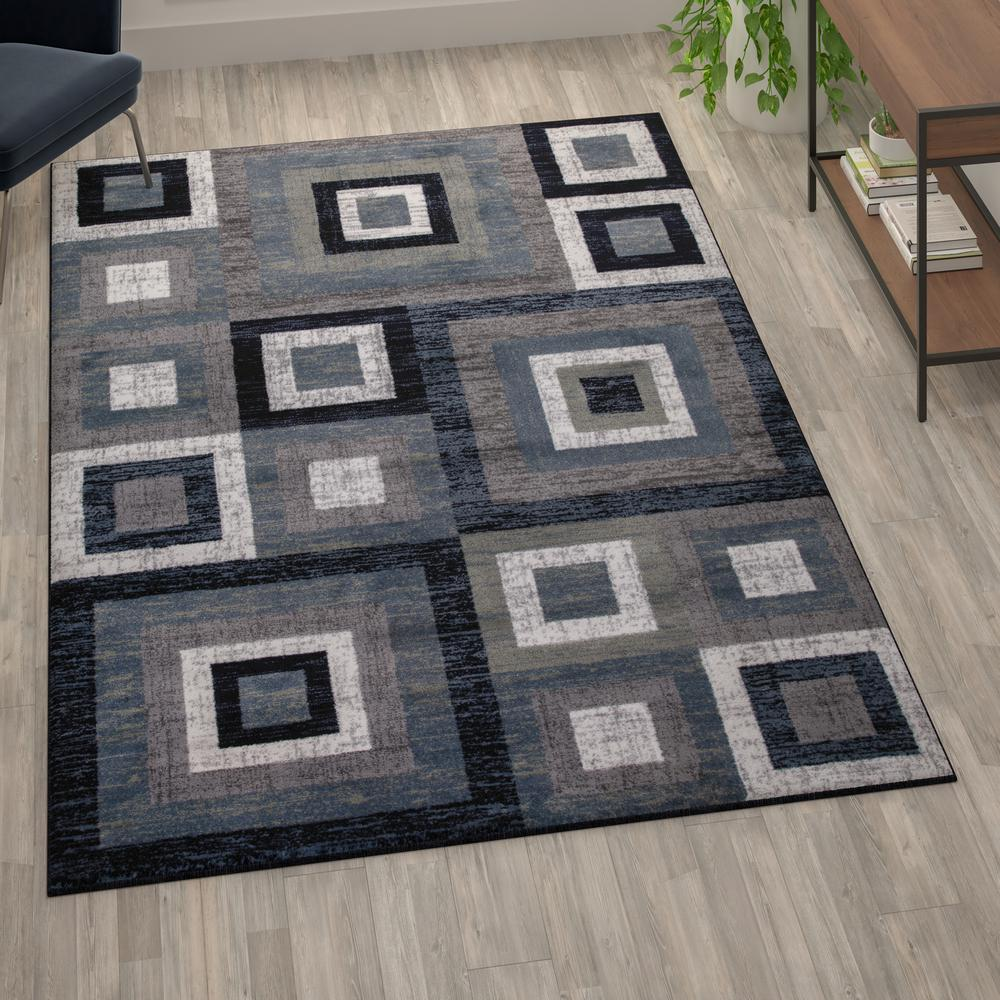 Geometric 6' x 9' Blue, Grey, and White Olefin Area Rug with Cotton Backing